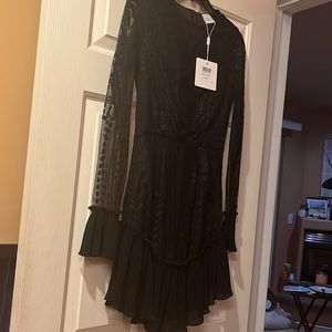 Black long sleeved lace dress in size S
